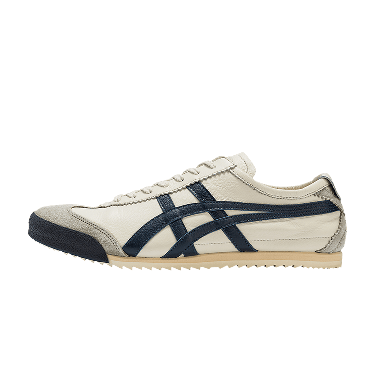 Onitsuka Tiger Mexico 66 Deluxe NM Birch Indigo Blue, zijaanzicht met crème en marine strepen, rubberen zool, klassiek design