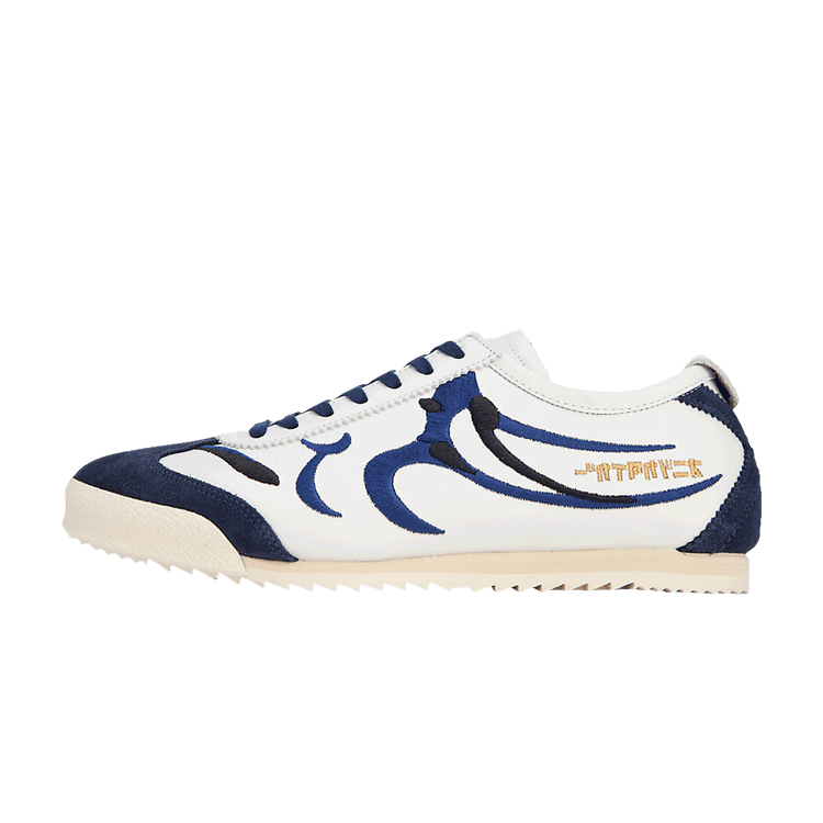 Onitsuka Tiger Mexico 66 Deluxe NM zijaanzicht, wit en marineblauw leer met gestileerde grafische lijnen