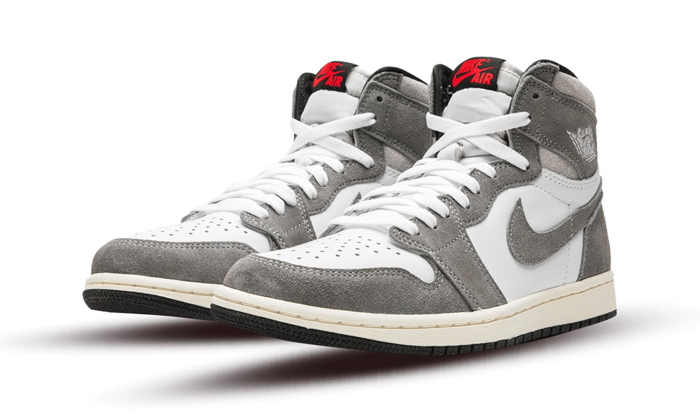 Pair of Nike Air Jordan 1 High OG Washed Black sneakers featuring white and washed black suede panels with red accents on the tongue, designed for exclusive sneaker enthusiasts in Europe.