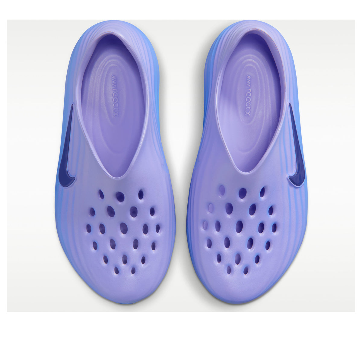Nike ReactX Rejuven8 Sapphire bovenaanzicht van paar samen met geventileerde gaatjespatroon en paarse binnenzool