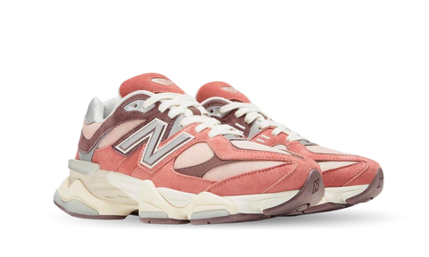 Pair of New Balance 9060 Cherry Blossom sneakers featuring pink and mauve tones with white laces and a chunky cream sole, exclusive in Europe, the real deal.