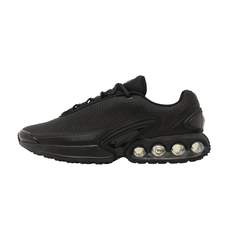 Nike Air Max Dn Black Metallic Grey, zijaanzicht met mesh-bovenwerk en vier zichtbare luchtcilinders in de zool