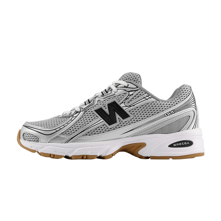 New Balance 740 zijaanzicht in grijs mesh met zwart N-logo, witte zool en gumkleurig accent, detailopname