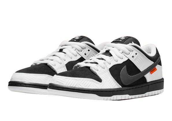 Pair of black and white Nike SB Dunk Low X TIGHTBOOTH sneakers with low-top design, white laces, and orange accents, exclusive in Europe. The real deal.