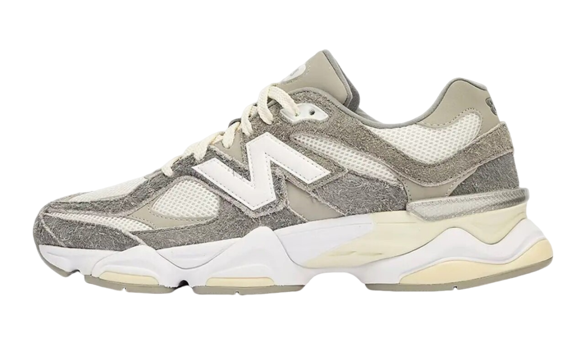 Side view of a New Balance 9060 Grey White sneaker featuring a mix of suede and mesh materials with neutral tones, designed for exclusive sneaker enthusiasts in Europe. The real deal.