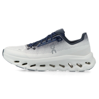 On Running Cloudtilt Midnight Ice white and navy sneakers with a breathable mesh upper and cushioned sole shown in side view on a black background