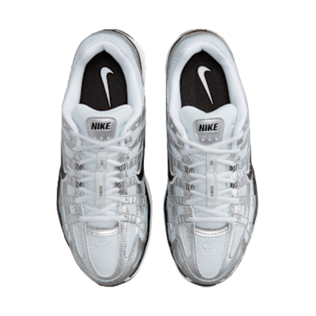 Top view of a pair of Nike P-6000 Metallic Silver Pure Platinum sneakers featuring white and metallic silver mesh and leather material with black insoles and Nike logo, exclusive in whole Europe. The real deal.