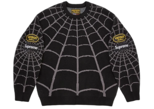 Supreme Vanson Leathers Spider-Man Sweater Black, vooraanzicht met spinnenwebpatroon in grijs en gele logo's op mouwen