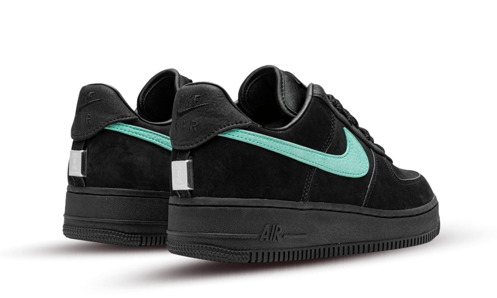 Black sneakers with turquoise accents and reflective details, showcasing the Nike Air Force 1 Low SP Tiffany And Co. design, exclusive in Europe. The real deal.