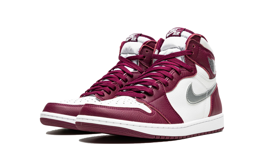 Pair of Nike Air Jordan 1 High OG Bordeaux sneakers featuring a white and deep red leather design with silver swoosh, perfect exclusive trainers for sneaker enthusiasts in Europe. The real deal.