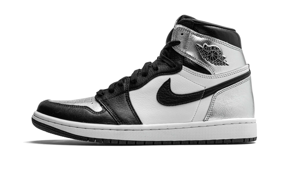 Side view of a black, white, and silver sneaker showcasing the Nike Air Jordan 1 High Silver Toe, an exclusive sneaker available in Europe from the real deal collection.