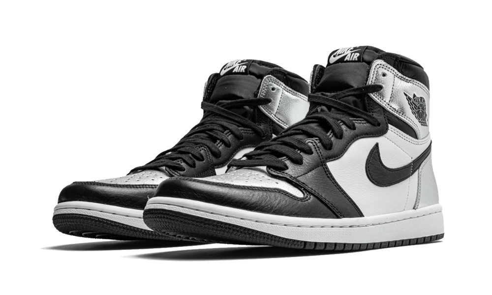 Pair of Nike Air Jordan 1 High Silver Toe sneakers featuring a black, white, and silver colorway, designed for sneaker enthusiasts across Europe. The real deal.