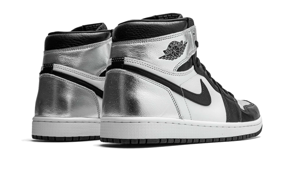 Pair of Nike Air Jordan 1 High Silver Toe sneakers in black, white, and silver leather, showcasing exclusive design and premium craftsmanship perfect for sneaker enthusiasts across Europe.