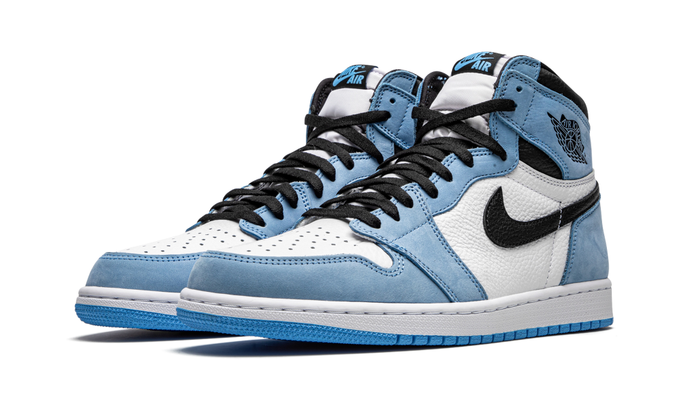 Pair of Nike Air Jordan 1 High University Blue sneakers featuring light blue suede overlays, white leather base, and black Nike swoosh, exclusive sneakers in whole Europe.
