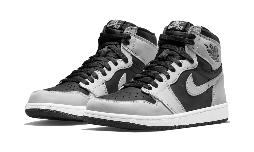 Pair of Nike Air Jordan 1 High Shadow 2.0 sneakers in black, white, and gray tones with high-top design and exclusive European style. The real deal.