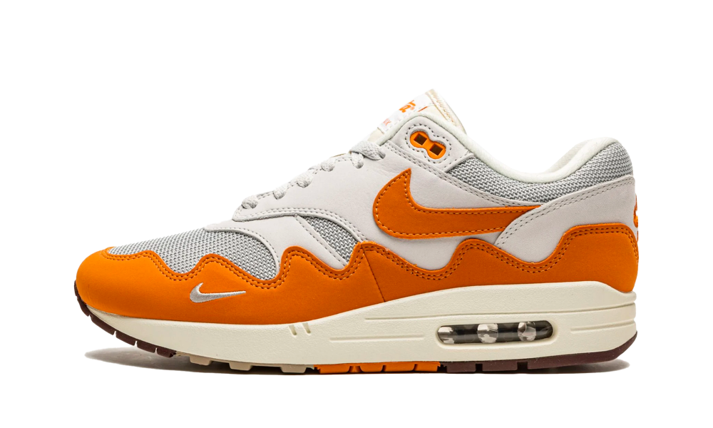 Nike Air Max 1 Patta Waves Monarch sneaker featuring orange and beige waves design, breathable mesh, and cushioned sole, perfect for exclusive sneaker collectors in Europe.