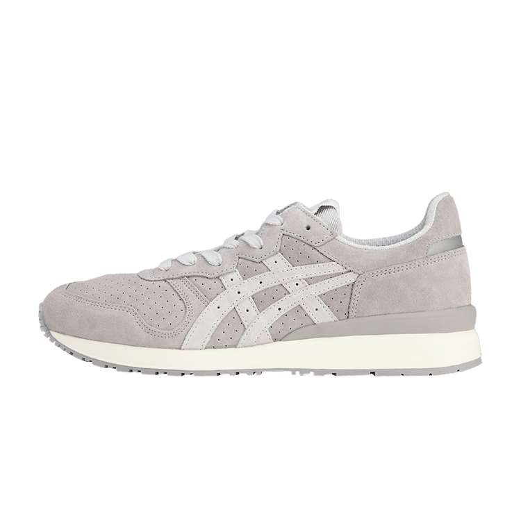 Onitsuka Tiger Tiger Ally Sheet Rock Piedmont Grey, zijaanzicht met grijze suède, witte strepen en crèmekleurige zool