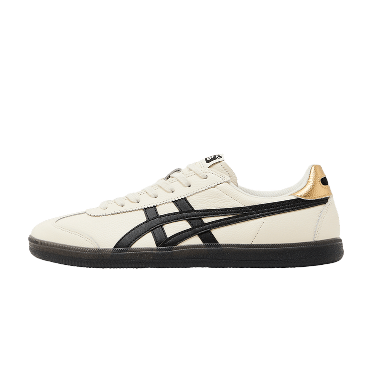 Onitsuka Tiger Tokuten White Black Gold, zijaanzicht met crème leerlook, zwarte strepen en gouden hielstukje