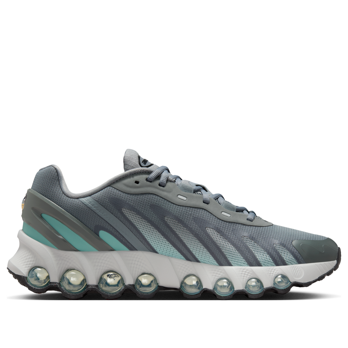Nike Air Max Dn8 Cool Grey Cannon zijaanzicht met acht bollige Air Max elementen en turquoise streep