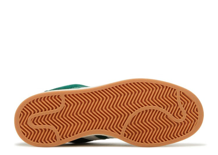 Sole view of Adidas Campus 00s Dark Green Cloud White sneaker showcasing durable gum rubber outsole with herringbone traction pattern, representing exclusive sneakers sold across Europe. The real deal.