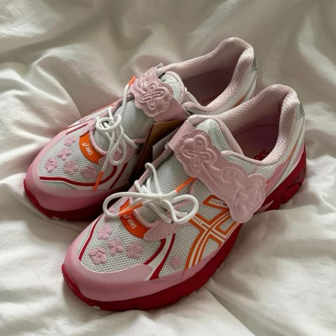 ASICS GT-2160 Cecilie Bahnsen Habanero sneakers in white, pink, and red with floral detailing and lace closure, showcased on a soft fabric background, exclusive sneakers in Europe.