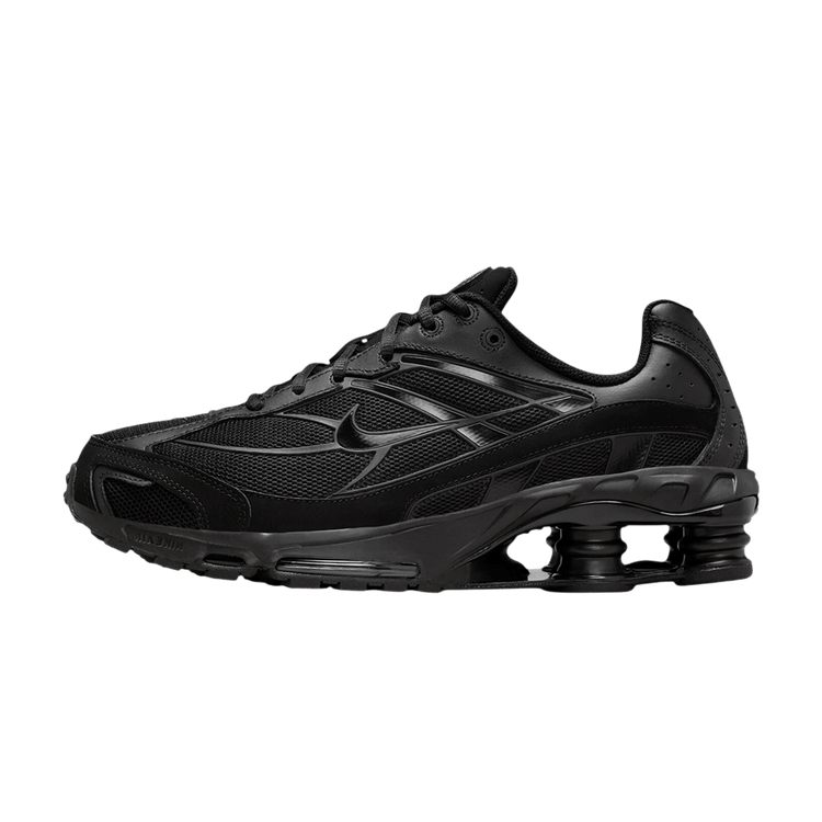 Nike Shox Ride 2 Black zijaanzicht met mesh en leren panelen, Shox-zool zwart