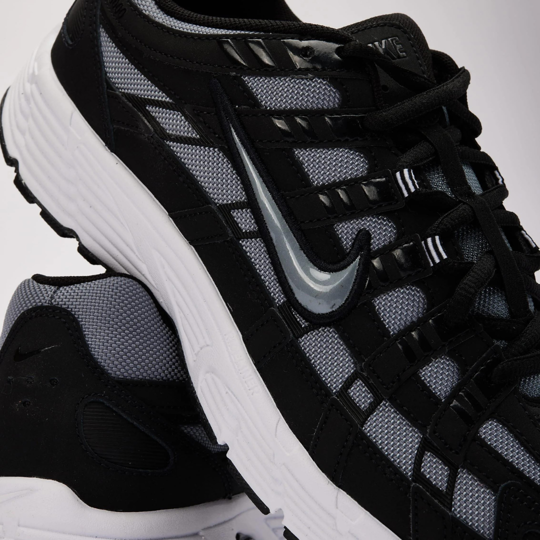 Close-up view of Nike P-6000 Black Cool Grey sneakers showcasing breathable mesh upper, black overlays, and white sole, perfect exclusive trainers for sneaker enthusiasts in Europe.