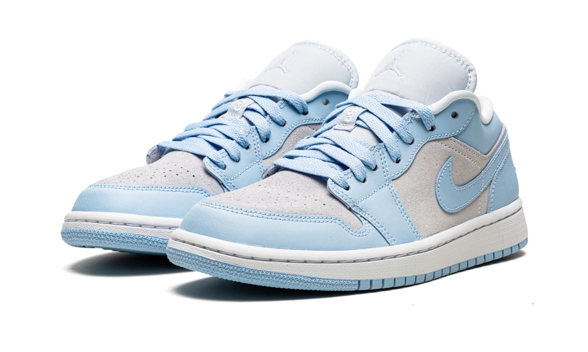 Pair of Air Jordan 1 Low Football Grey Aluminum sneakers in light blue and grey tones, showcasing premium materials and exclusive European design flair. The real deal.