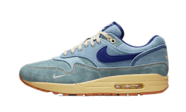 Side view of Nike Air Max 1 PRM Dirty Denim sneaker featuring blue denim and suede upper with a beige midsole and air cushioning, a staple exclusive sneaker in Europe.