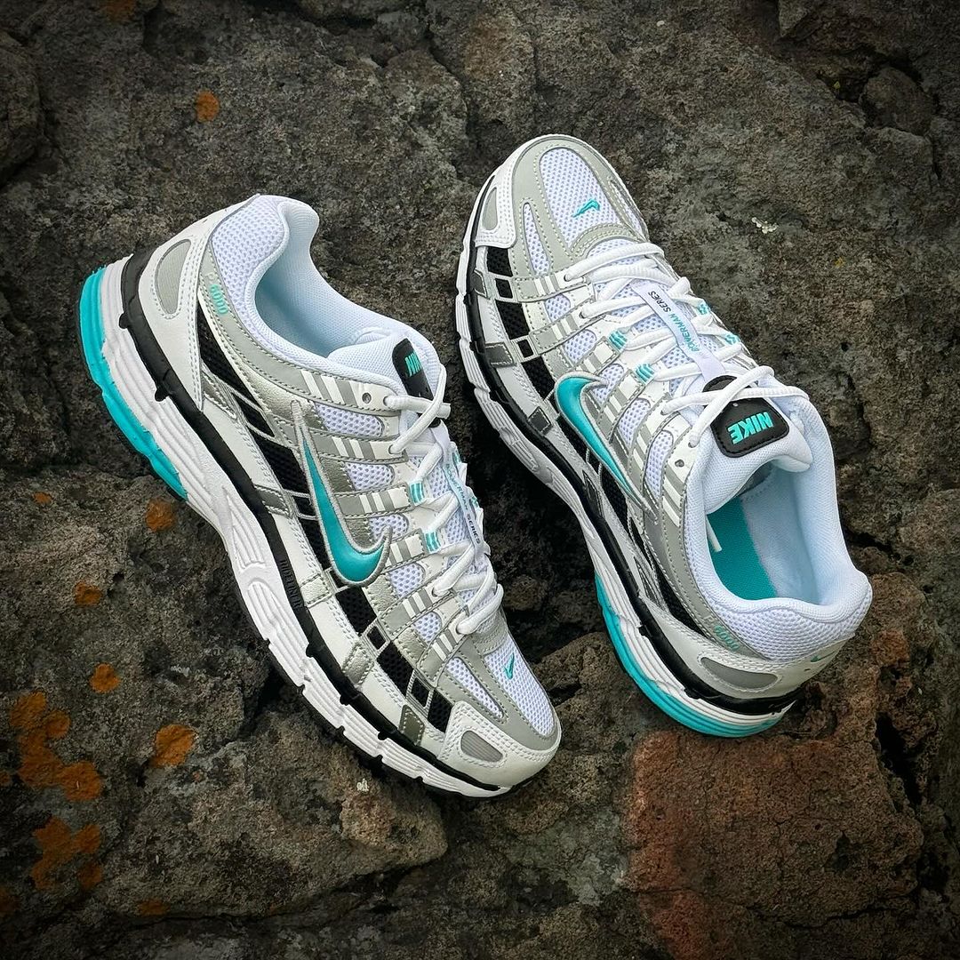 Pair of Nike P-6000 Dusty Cactus sneakers in white and muted green with teal accents, designed for exclusive sneaker enthusiasts in Europe, embodying the real deal in stylish trainers.