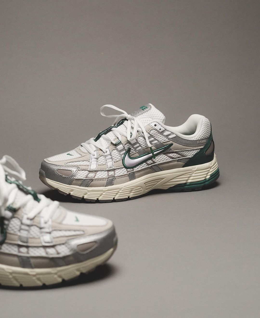 Pair of Nike P-6000 Premium Light Bone Bicoastal Green sneakers showcasing a sleek modern design with light bone and dark green accents, perfect exclusive trainers in Europe.
