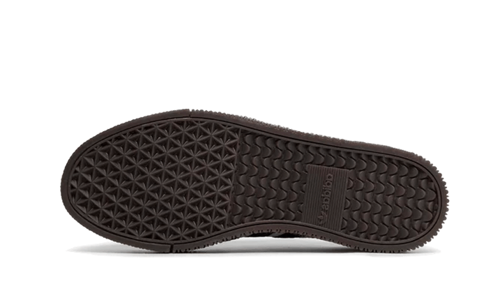 The sole of the Adidas Sambarose White Black Gum sneaker featuring a textured black rubber outsole designed for grip and durability, exclusive sneaker style in Europe.