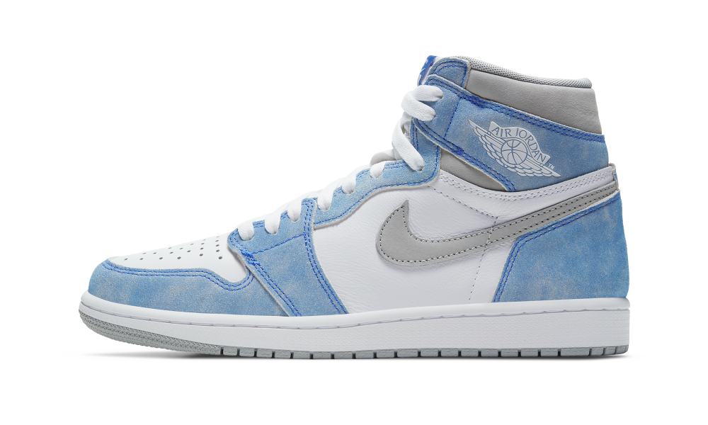 Side view of Nike Air Jordan 1 High Hyper Royal sneaker showcasing white leather with light blue and grey suede accents, exclusive trainers available throughout Europe. The real deal.