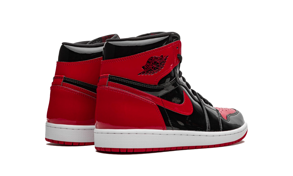 Pair of Nike Air Jordan 1 High OG Bred Patent sneakers, featuring black and red patent leather with a white midsole, classic high-top design, exclusive sneakers in whole Europe. The real deal.