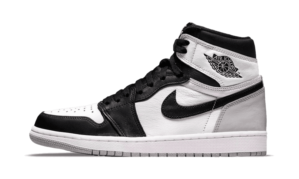 Side view of Nike Air Jordan 1 High OG Stage Haze sneaker in white, black, and gray tones, showcasing exclusive European design with premium materials. The real deal.