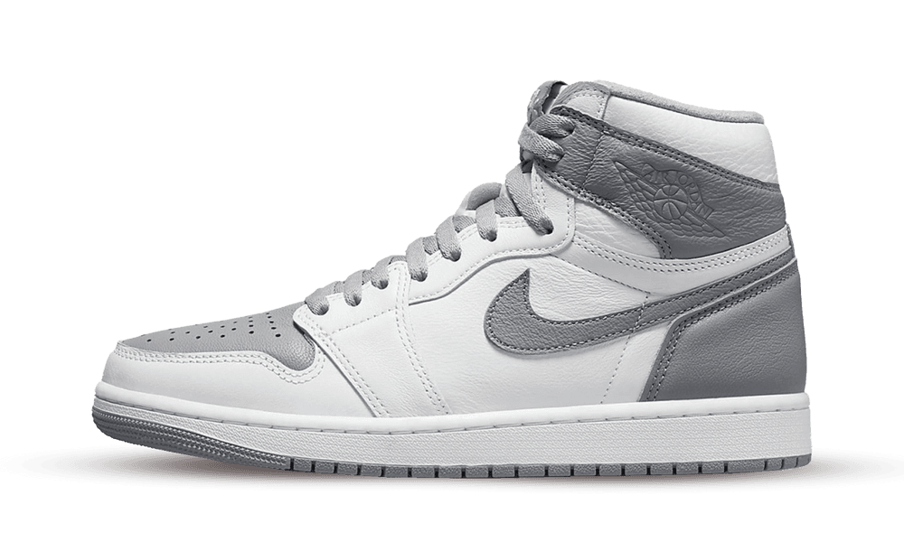 Side view of the Nike Air Jordan 1 High OG Stealth sneaker in white and gray tones, showcasing premium leather and classic high-top design, exclusive in Europe. The real deal.