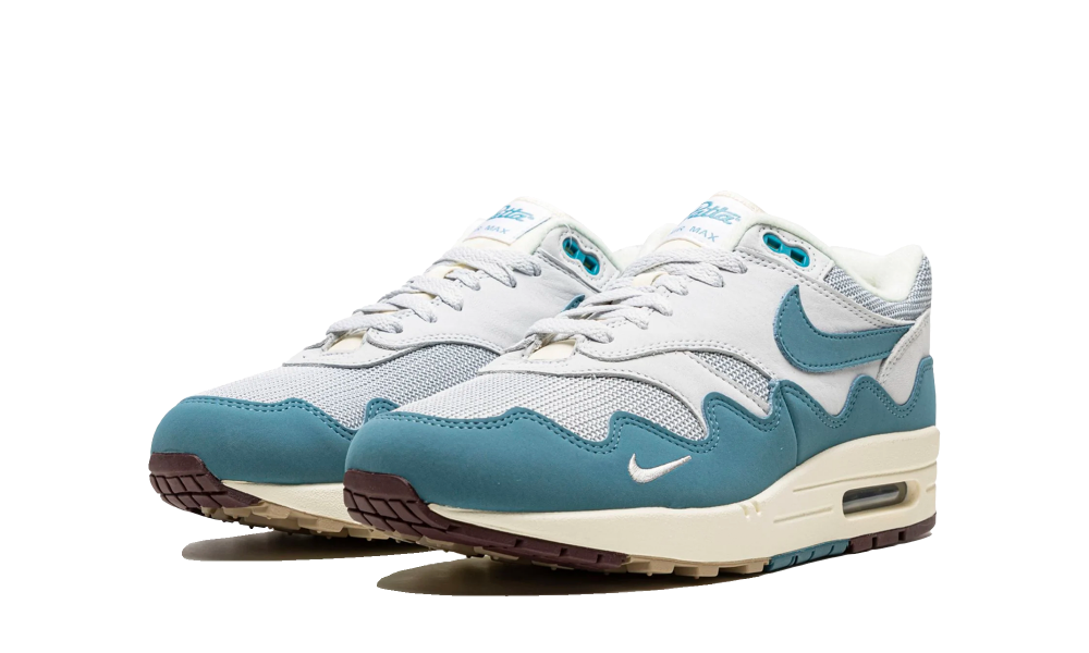 Pair of Nike Air Max 1 Patta Waves Noise Aqua sneakers featuring aqua wave design, white mesh upper, and cream midsole, exclusively sold in Europe. The real deal.