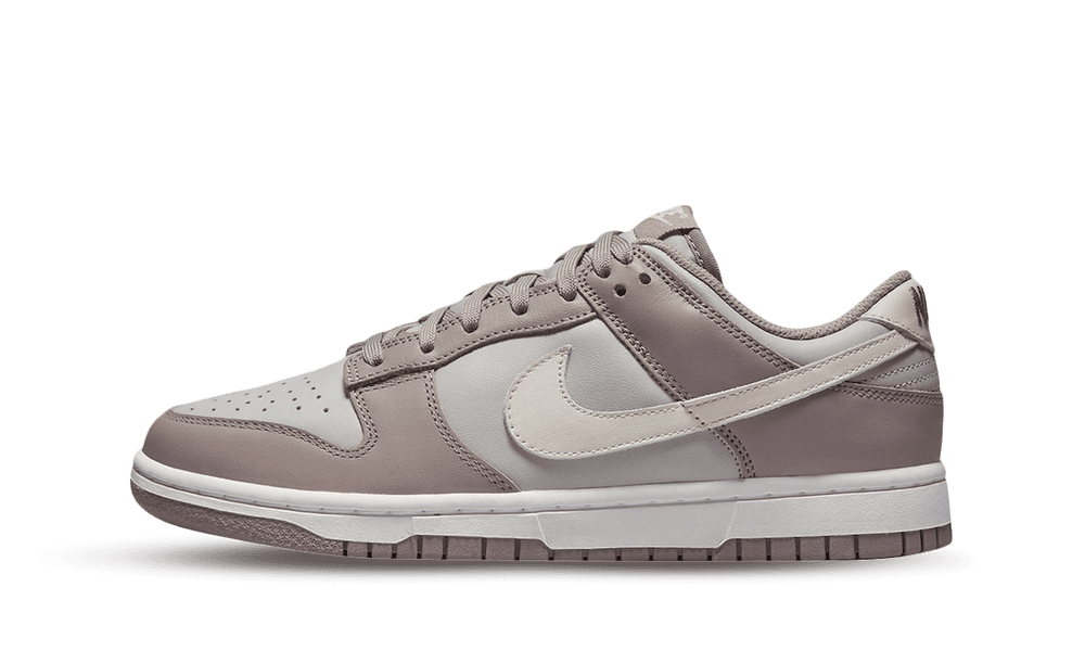 Side view of a Nike Dunk Low Bone Beige sneaker showcasing a sleek beige and bone color combination with premium leather material, perfect exclusive trainers in Europe, the real deal.