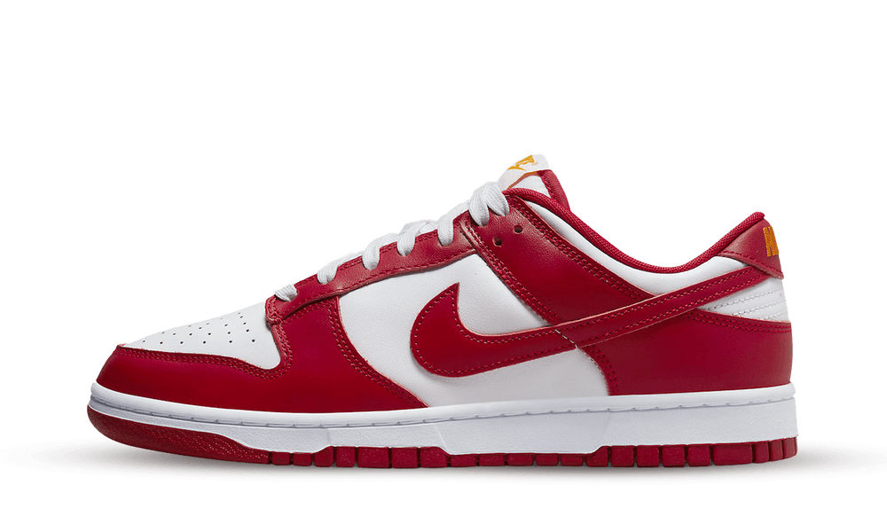 Side view of the exclusive Nike Dunk Low USC sneaker in red and white leather, showcasing its classic low-top design and signature swoosh, the real deal in sneakers.