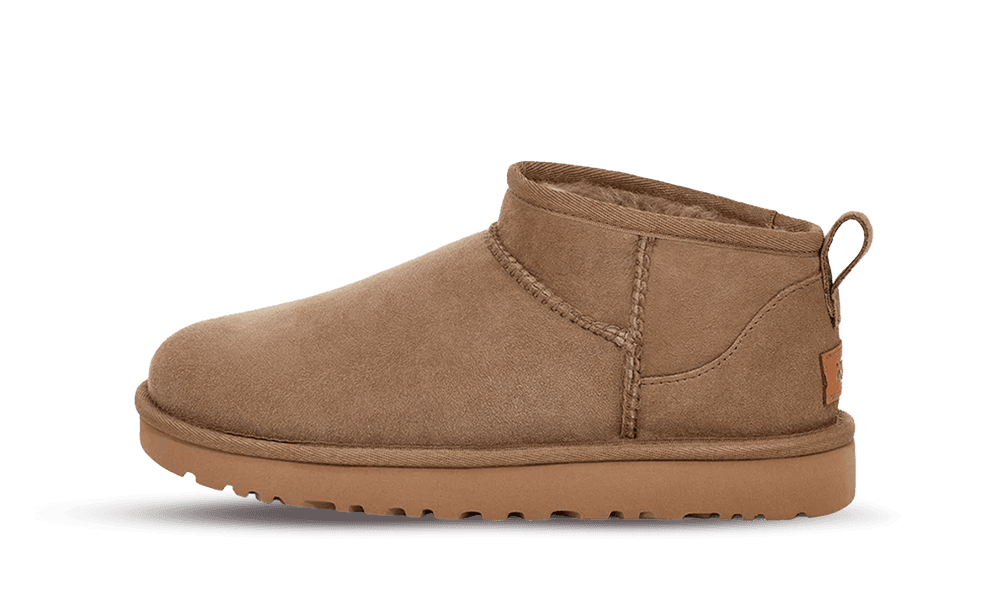 Side view of a tan UGG Classic Ultra Mini Antilope sheepskin shoe with a low ankle height and durable sole, designed for comfort and casual wear.